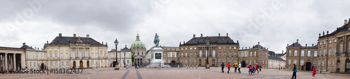 COPENHAGEN, DENMARK - MAY 31, 2017: Panoramic view of Amalienborg Slotsplads square with equestrian statue of Amalienborg's founder, King Frederick V and Frederik's Church on background, Copenhagen