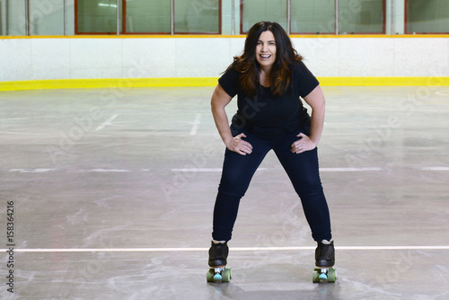 happy woman quad roller skating photo