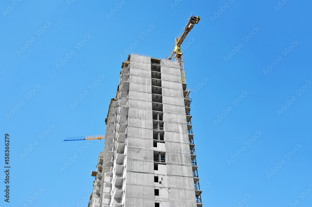 Crane and highrise construction site