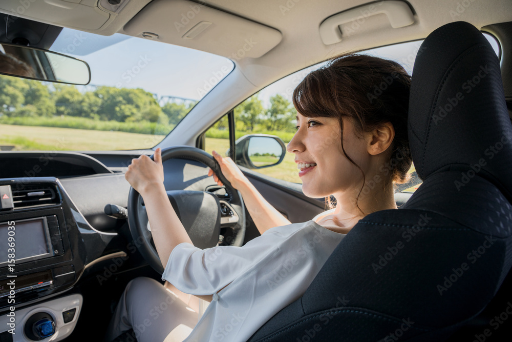 young woman driving a car.