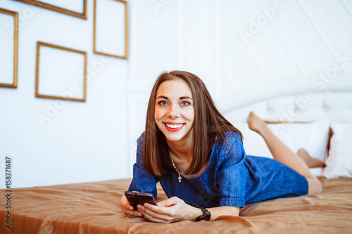 girl on bed with phone