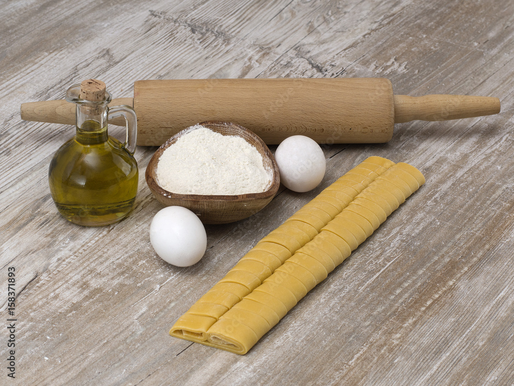 Italian pasta on a wooden table. Italian pasta on a wooden table.