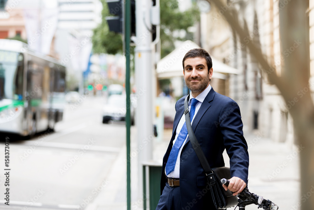 Young businessmen with a bike