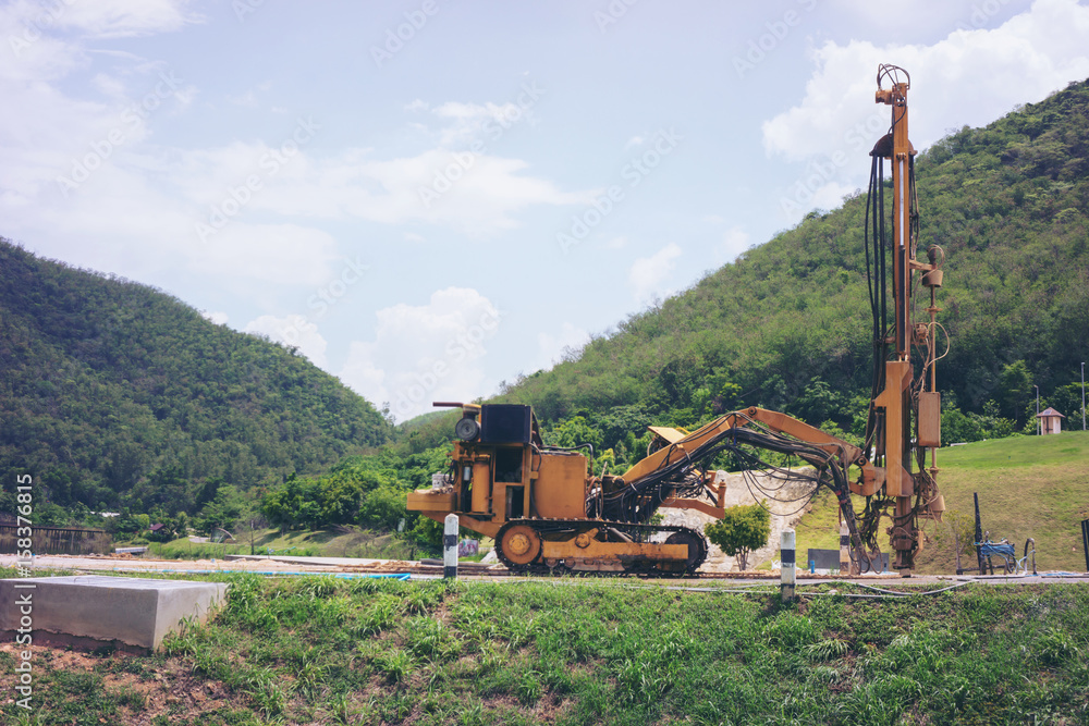 Fototapeta premium Ground water hole drilling machine. selective focus