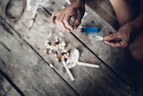 Drug addict young woman with syringe in action, Drug abuse concept.