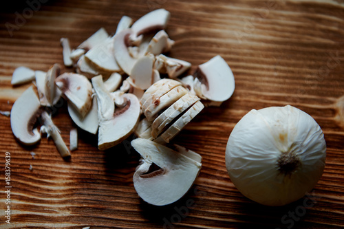 The process of cooking.mushrooms whole and sliced