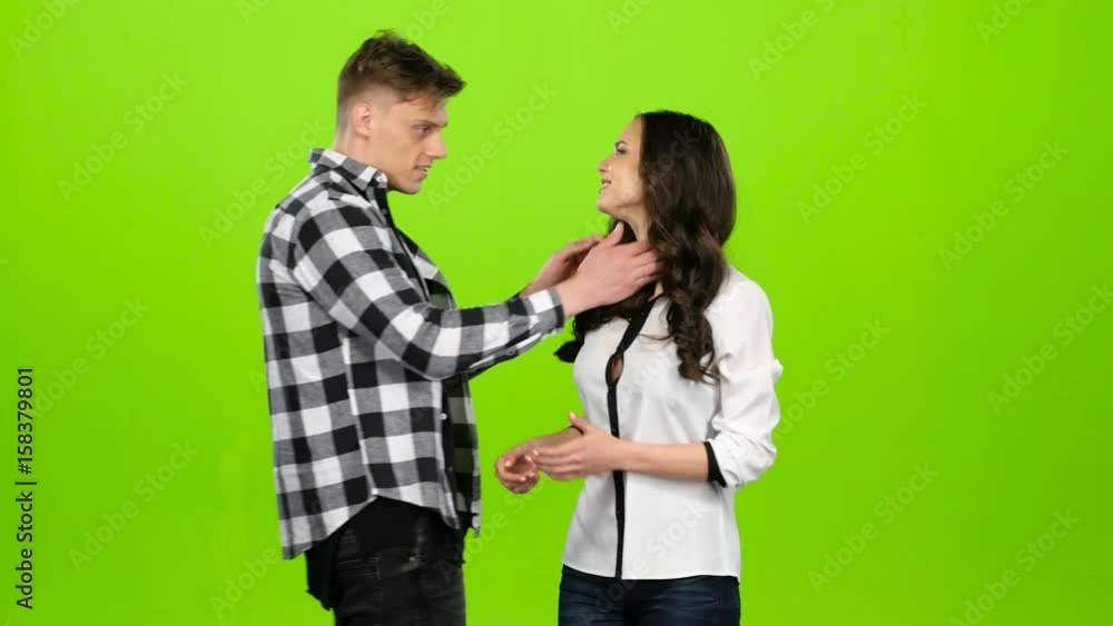 Girl is waiting for her beloved guy, he comes and gently kisses. Green screen Girl is waiting for her beloved guy, he comes and gently kisses. Green screen