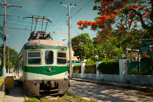 Vintage image of an old electric train in Cuba