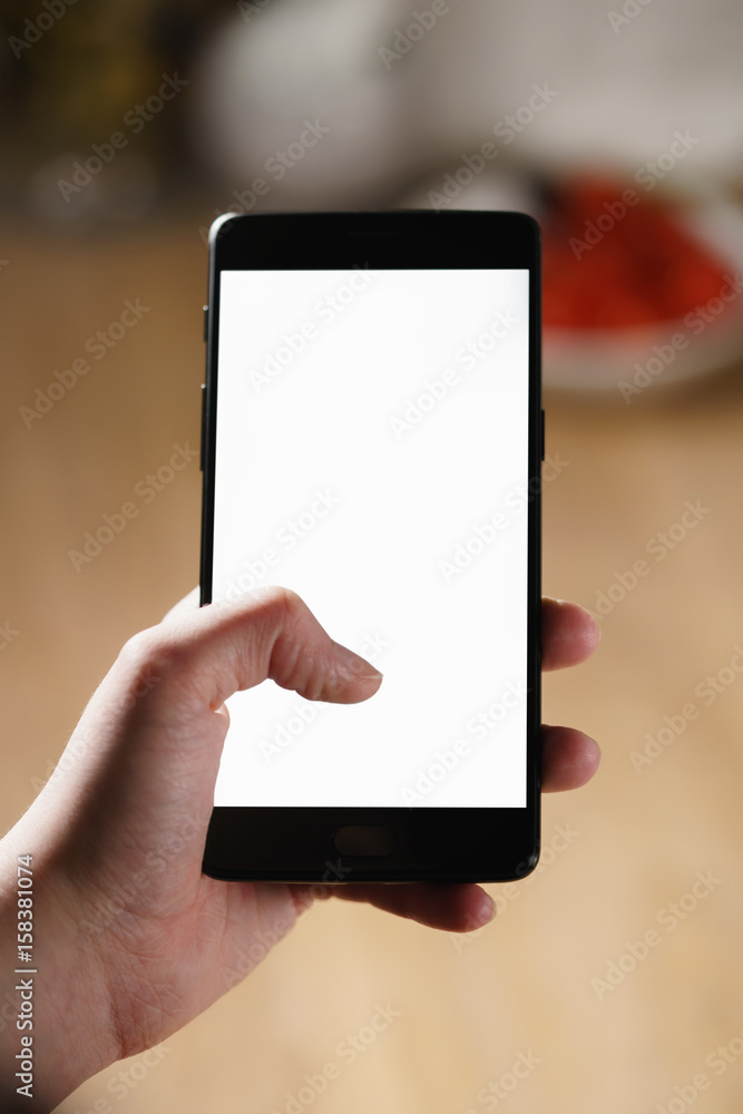 female teen hand using smartphone with blank white screen, shallow focus female teen hand using smartphone with blank white screen, shallow focus
