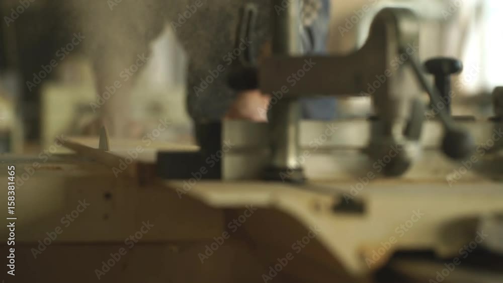 a man cuts a Board manual electric saw ,close-up , concept building and repair a man cuts a Board manual electric saw ,close-up , concept building and repair