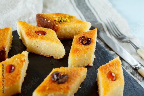 Arab traditional basbousa with different nuts. Eastern dessert from semolina.
