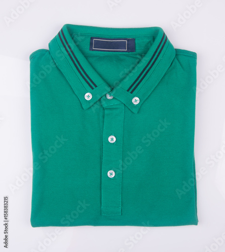 shirt or mens folded polo shirt on background.