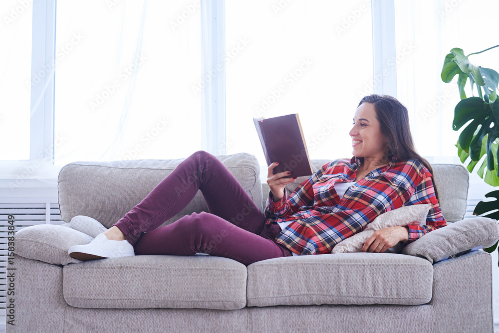 Delightful brunet having rest while reading book Delightful brunet having rest while reading book