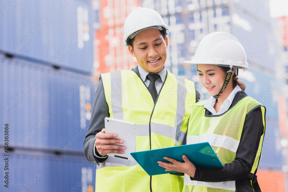 Secretary and businessman in logistic, export, import industry with shipping cargo container freight in background. Secretary and businessman in logistic, export, import industry with shipping cargo container freight in background.
