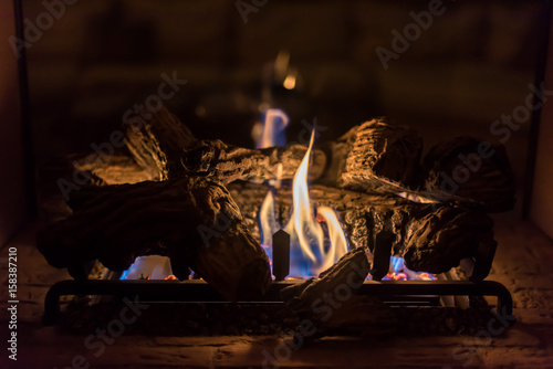 cozy romantic gas log fireplace in evening
