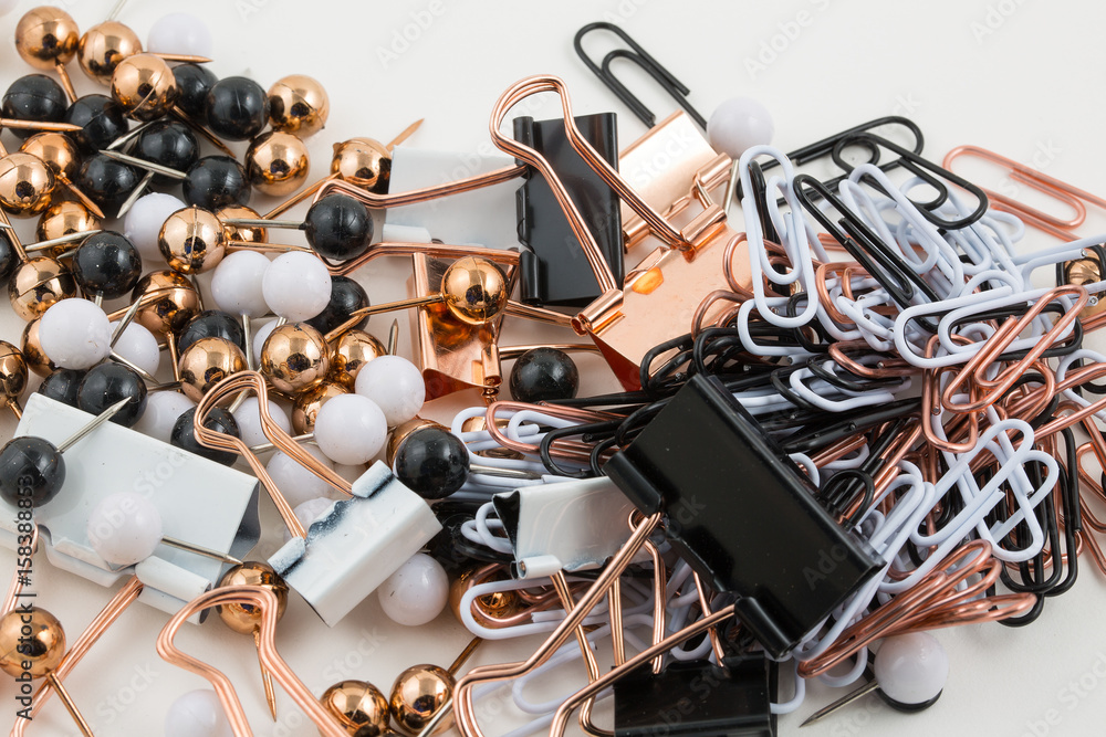 Pile of paper clips and tacks onwhite background Pile of paper clips and tacks onwhite background