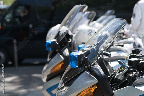 Berlin, Germany - May 31, 2017: German police helmets resting on the handlebars of motorcycles. Selective focus