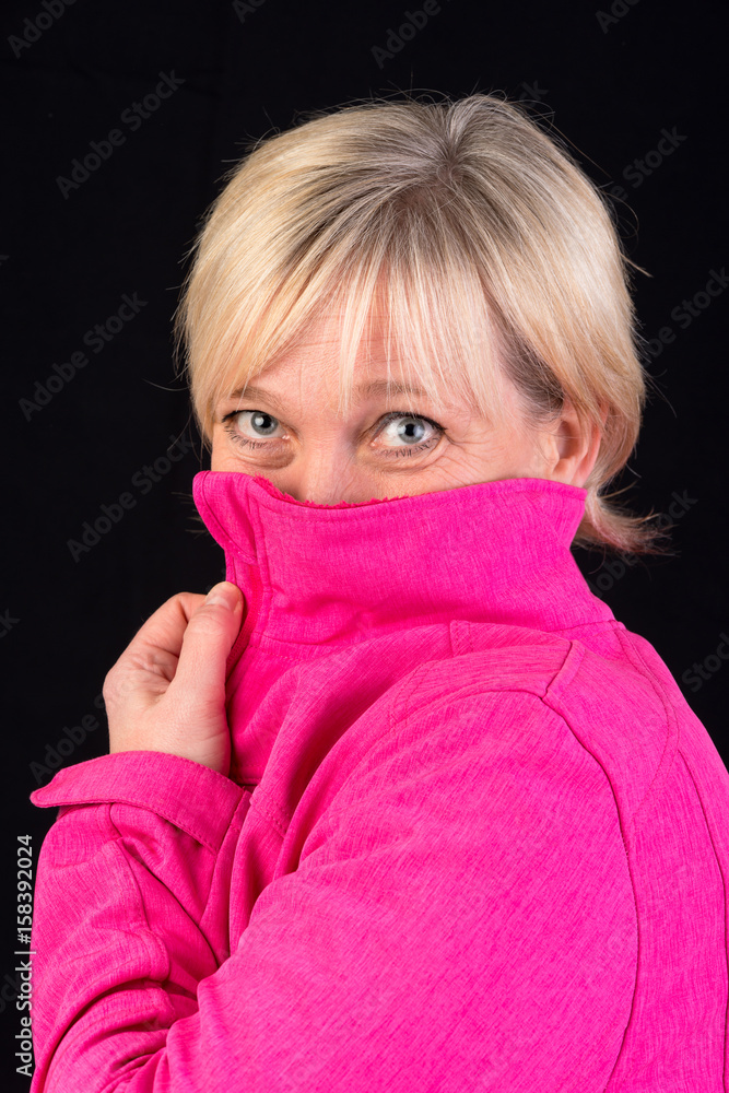 Beautiful european mature woman in pink soft shell portrait - photograph on black background Beautiful european mature woman in pink soft shell portrait - photograph on black background