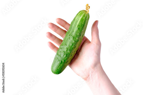 Woman hand holding green cucumbers isolated on white