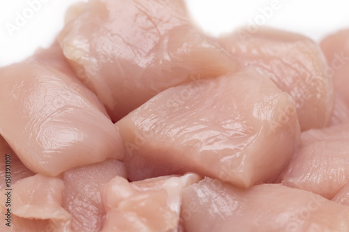 Top view of raw chicken fillet chunks isolated on white