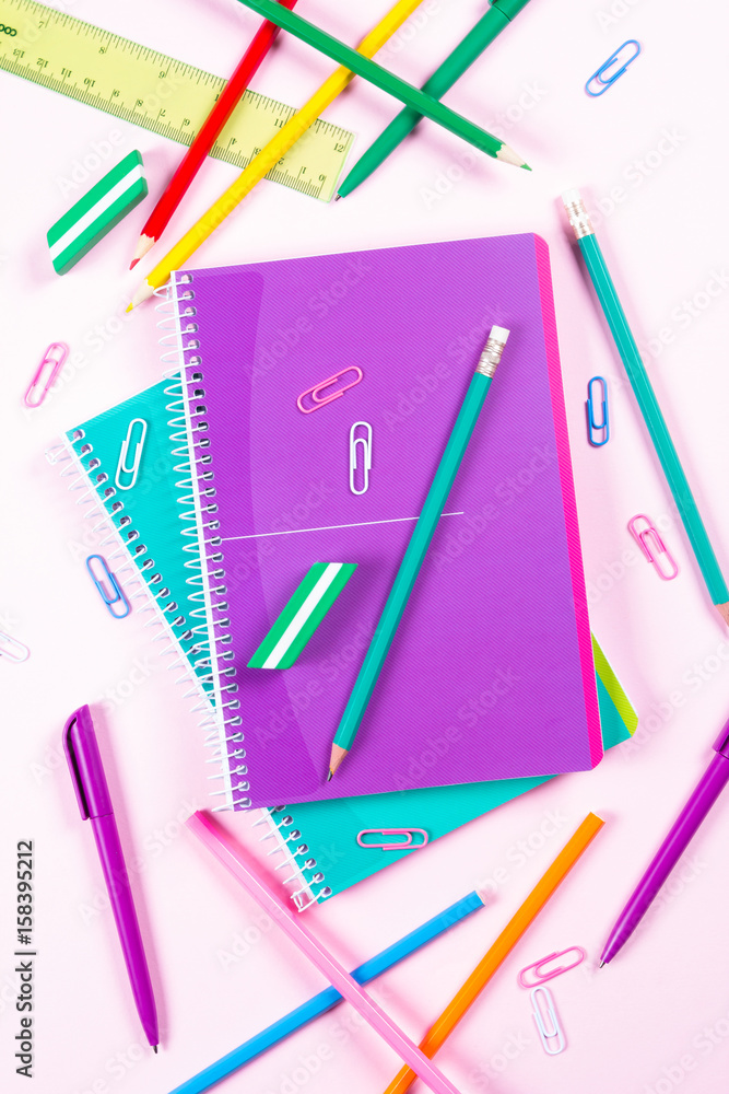 School stationery on pink background with copyspace School stationery on pink background with copyspace