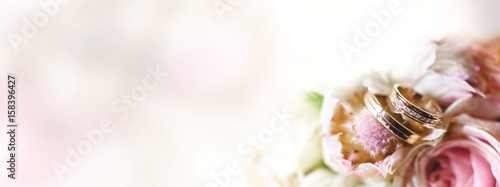 Background with wedding rings in light tone