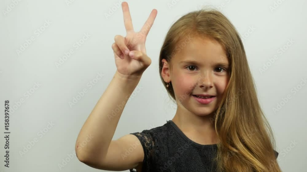 Pretty girl showing countdown on the hand. Portrait of beautiful smiling girl showing numbers from five to zero by fingers Pretty girl showing countdown on the hand. Portrait of beautiful smiling girl showing numbers from five to zero by fingers