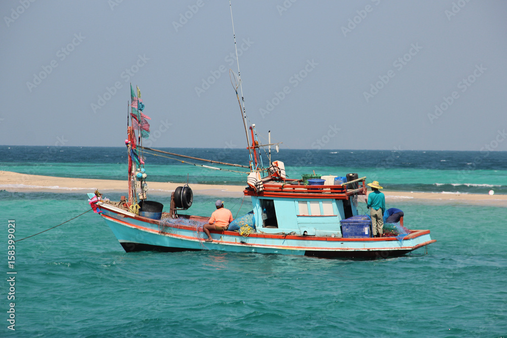 Fishing boat fishing in the open sea for a big fish
