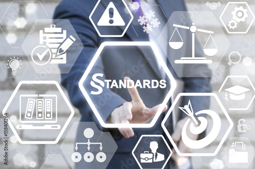 STANDARDS LAW COMPLIANCE REGULATIONS BUSINESS concept. Businessman touched paragraph standard text icon on virtual screen. Judical people work security technology.