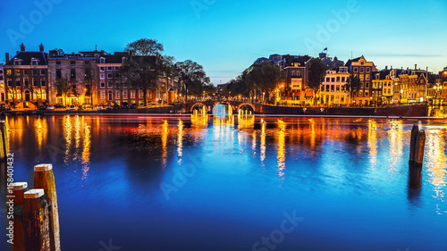 Photography The most famous canals and embankments of Amsterdam city during sunset