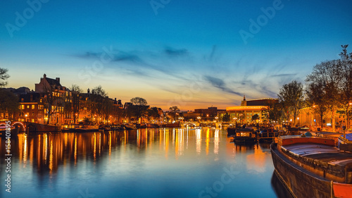 Photography The most famous canals and embankments of Amsterdam city during sunset