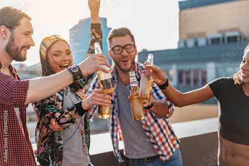 Wall Mural Excited guys and girls having party outdoor