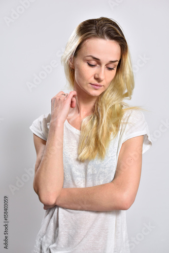 Portrait of a sad girl on a white background