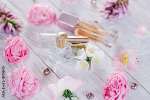 Bottles of perfume with flowers