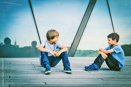 Photography Two boys friends talking with each other