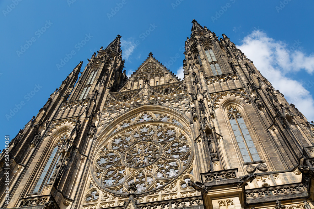 Closeup view on gothic cathedral of St. Vitus with blue sky and clouds in Prague Castle, Prague, Czech Republic