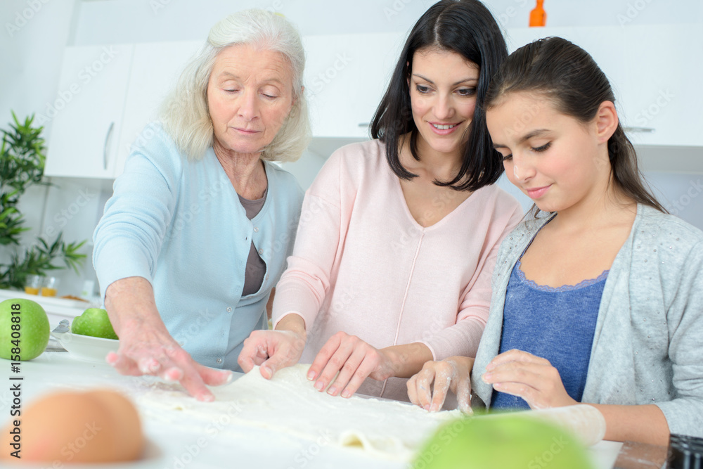 Children baking with their grandmother Children baking with their grandmother