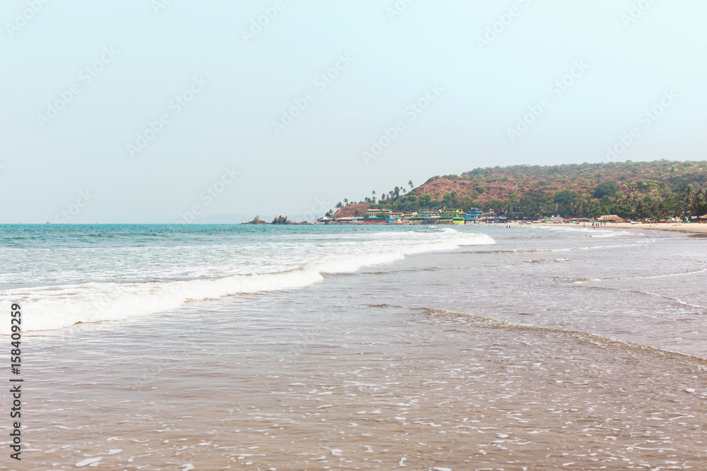 Goa, India, the beach of Arambol. Idyllic tropical beach, coastline of the ocean.