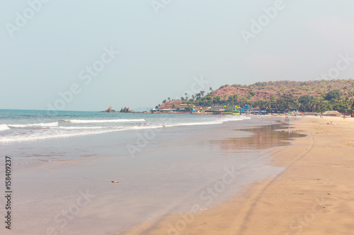 Goa, India, the beach of Arambol. Idyllic tropical beach, coastline of the ocean.