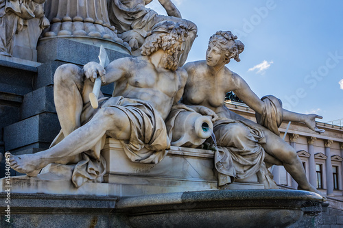 Fragments of the Pallas Athena (goddess of wisdom) fountain, in front of the Austrian Parliament Building. The figures symbolize the rivers Danube, Inn, Elbe and Moldau. Vienna, Austria, Europe.