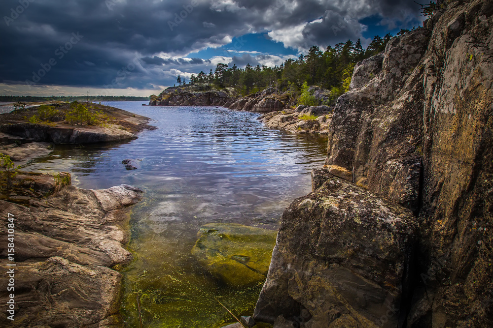 Rocky coast. Rocky coast of the island. Island with rocks. Karelia. Ladoga lake.