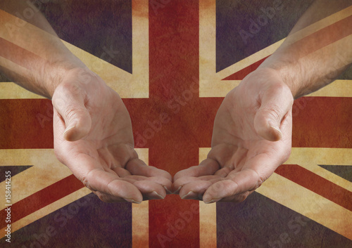 Cuadro en lienzo Support Great Britain - Male hands in open gesture against a rustic parchment Un