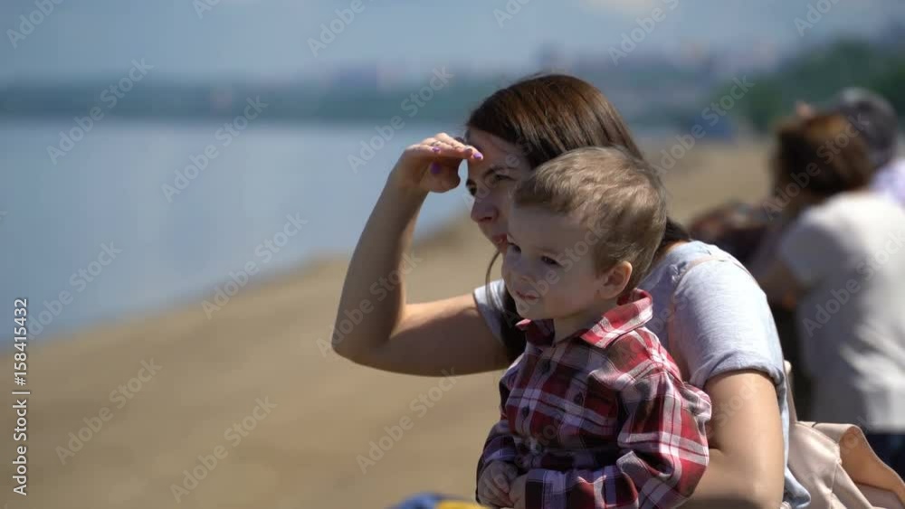 mom and son Looking Ahead on the waterfront. mom and son Looking Ahead on the waterfront.