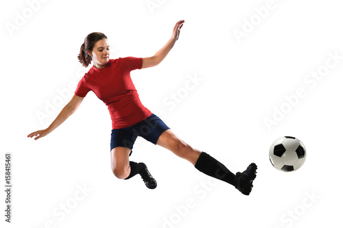 Female Soccer Player Kicking Ball