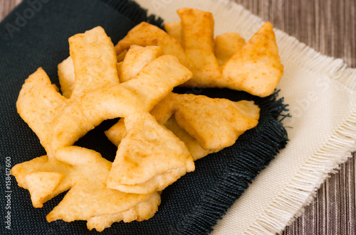 Closeup of delicious ecuadorian pristinos, piled up fresh from the fryer, traditional andean pastry suitable for coffee meetings photo