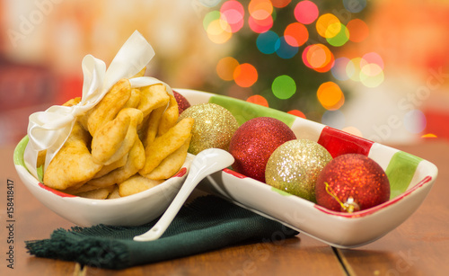 Delicious ecuadorian pristinos piled up in bowl, traditional andean pastry, fruit platter sitting besides photo