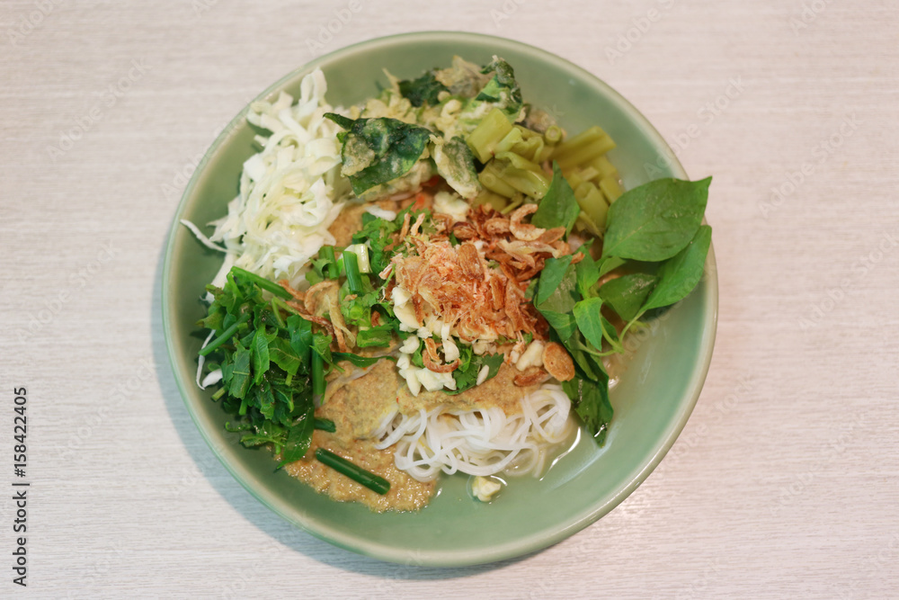 Thai Noodles (Kanom jeen) in a green dish. Thai Noodles (Kanom jeen) in a green dish.