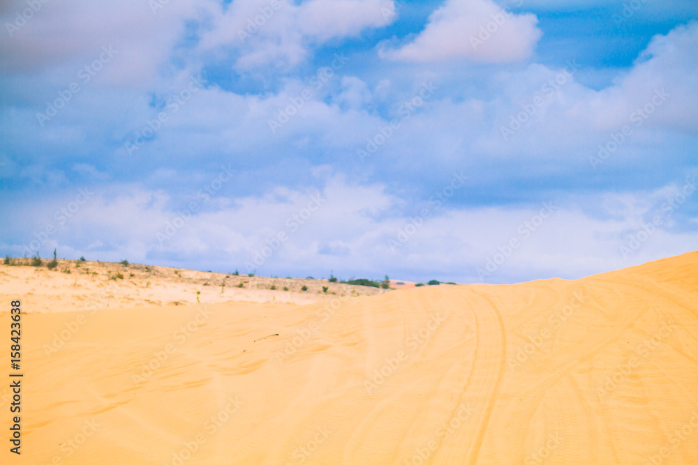 White Desert At Mui Ne / Sunny Day With Blue Sky And Clouds On Sand Dune White Desert At Mui Ne Vietnam. White Desert At Mui Ne / Sunny Day With Blue Sky And Clouds On Sand Dune White Desert At Mui Ne Vietnam.