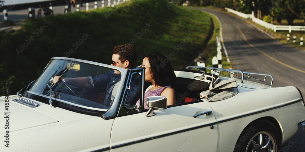 Couple Driving a Car Traveling on Road Trip Together Couple Driving a Car Traveling on Road Trip Together