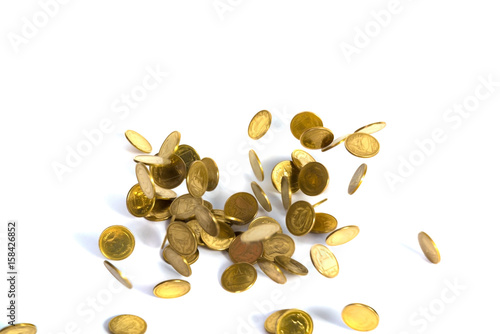 Falling gold coins. Money on a white background. shallow focus.
